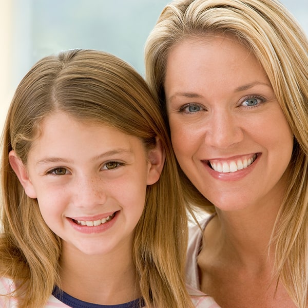 Your Guide to Nearby Solutions A girl and her mother smilling