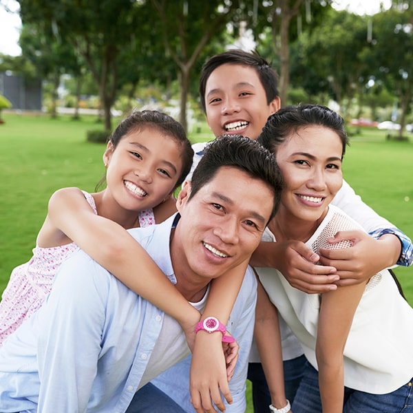 Promoting Overall Health Through Pediatric Oral Care A happy smilling family