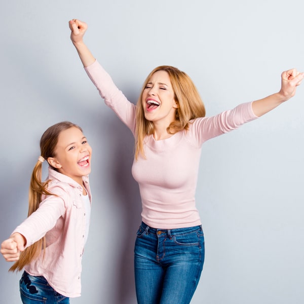 Ensuring Comfortable Care for Every Child Happy dancing litle girl and woman