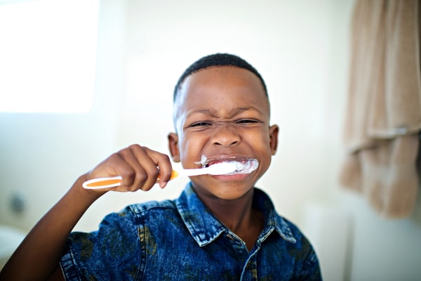 Preventive Dental Care for Kids A child brushing his teeth
