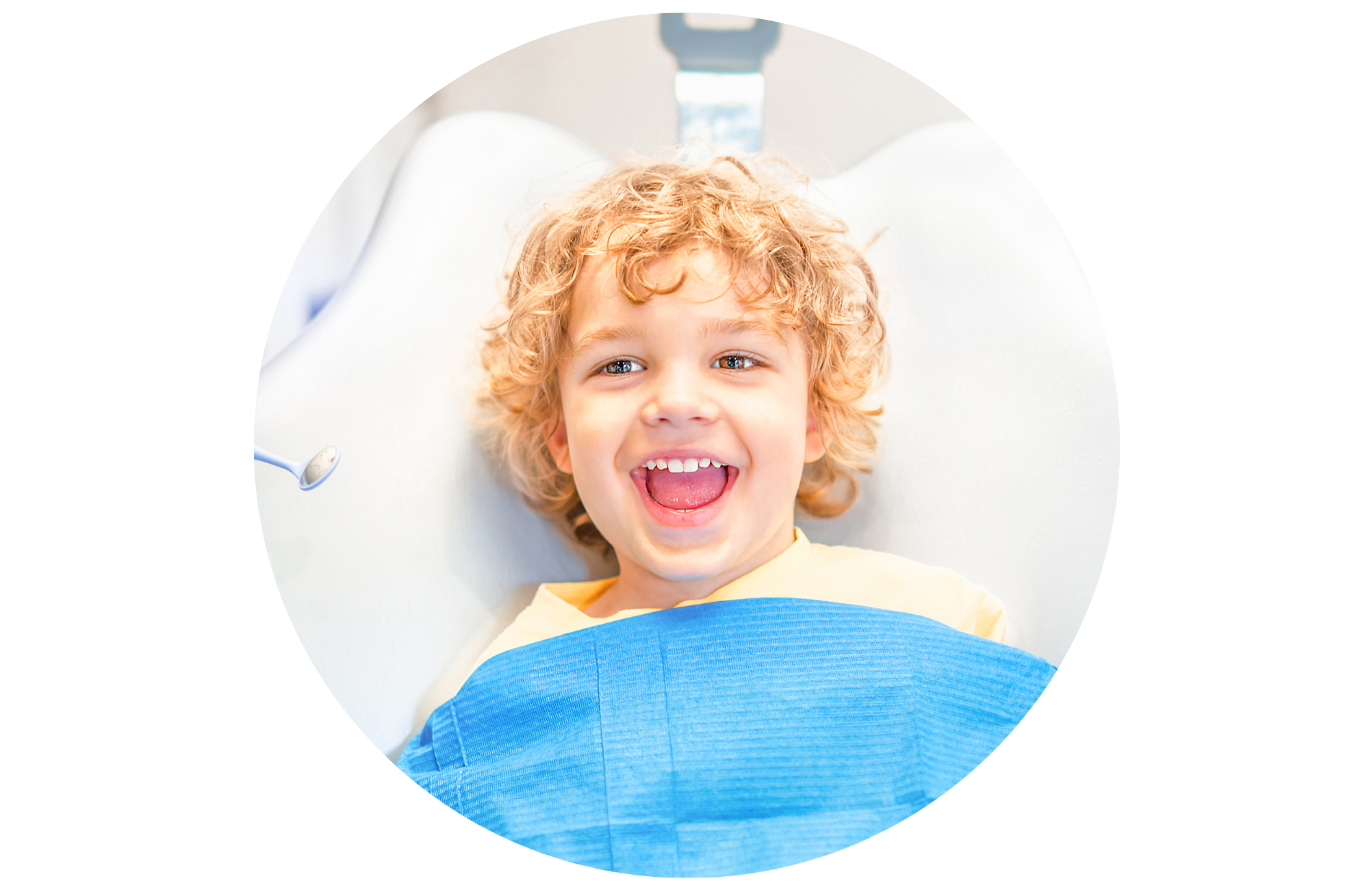 A young boy smiling in the dentist chair